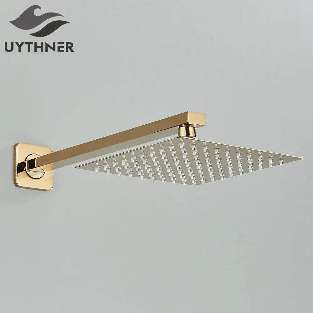 Gold-finished modern hammered square wall mounted shower head with brushed metal surface and sleek design
