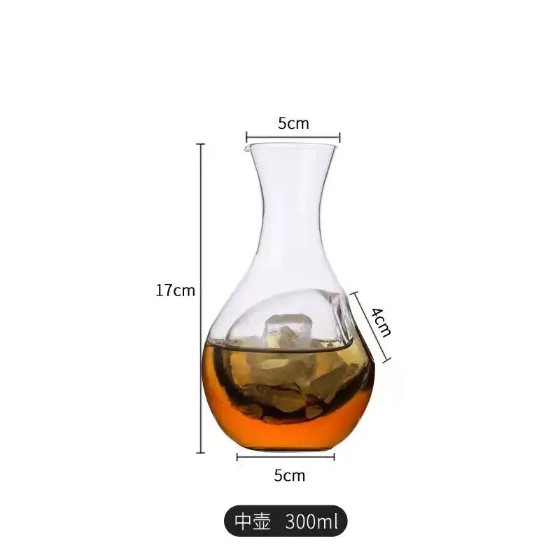 Clear glass wine decanter with curved neck and amber liquid in decorbites crystal glass modern hamster nest set
