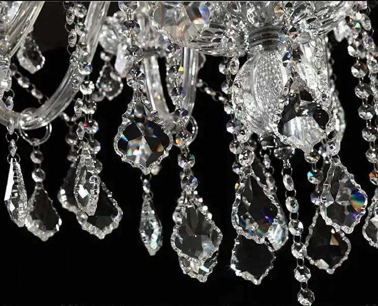 Modern hand blown crystal chandelier light with faceted teardrop and bead pendants for dining room use