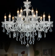 Modern hand blown crystal chandelier light with clear glass arms and teardrop crystals for dining room illumination