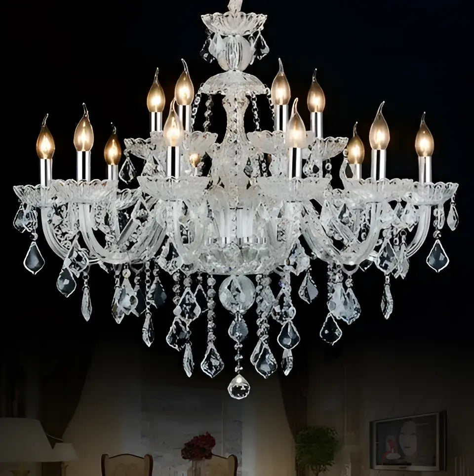 Modern hand blown crystal chandelier light with clear glass arms and teardrop crystals for dining room illumination