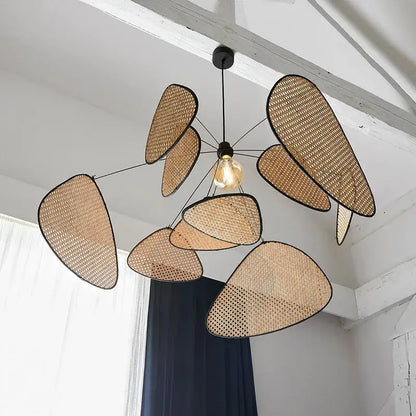 Modern hand made rattan pendant chandelier with beige woven design and black leaf-shaped panels for living room lighting