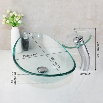 Clear glass vessel sink with sleek modern design and chrome basin mixer faucet for bathroom use