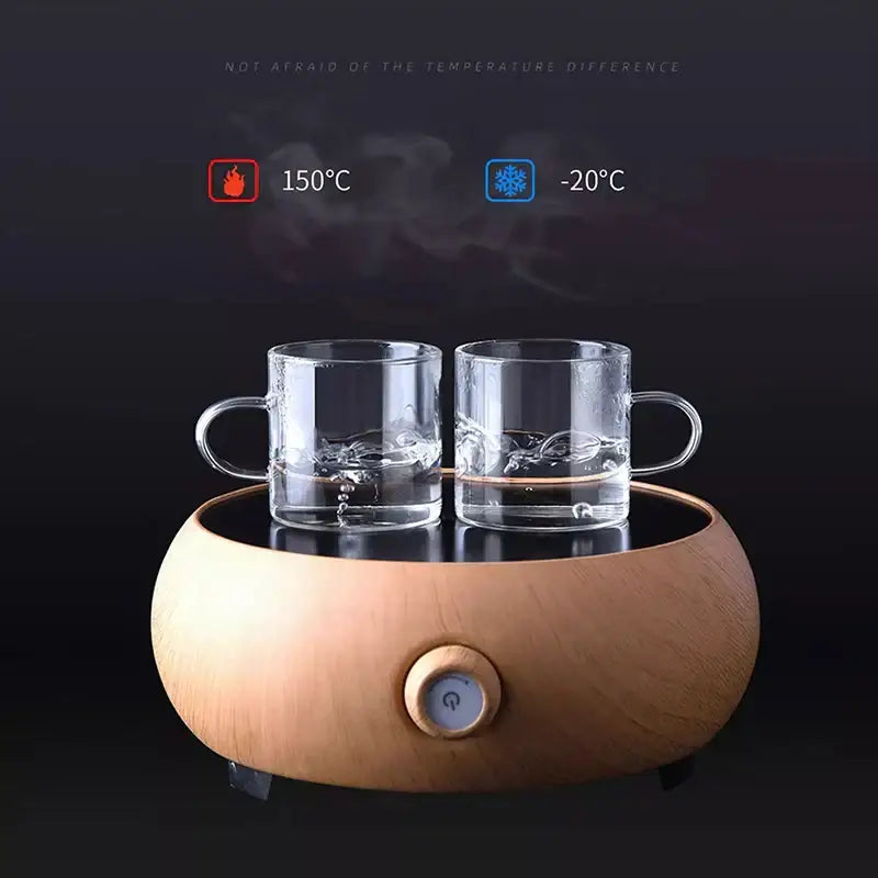 Modern wooden oval-shaped electric hot and cold water heater with two clear glass mugs from tea cup set