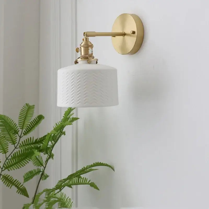 Modern white ceramic wall lamp with textured chevron pattern and brass arm for decorbites copper led sconce lighting