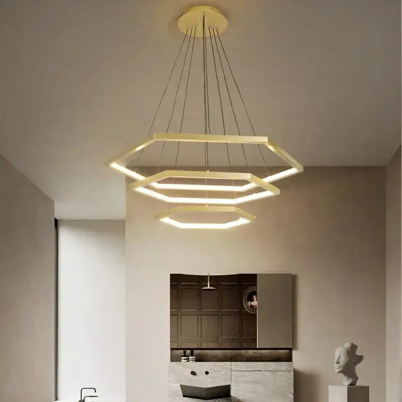 Modern hexagon aluminium led pendant light with sleek metallic finish and warm glowing illumination for living room decorbites pendant light