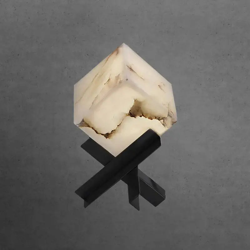 Modern hexagonal cube marble table lamp with translucent white and beige veining on black metal stand for decorbites cube marble
