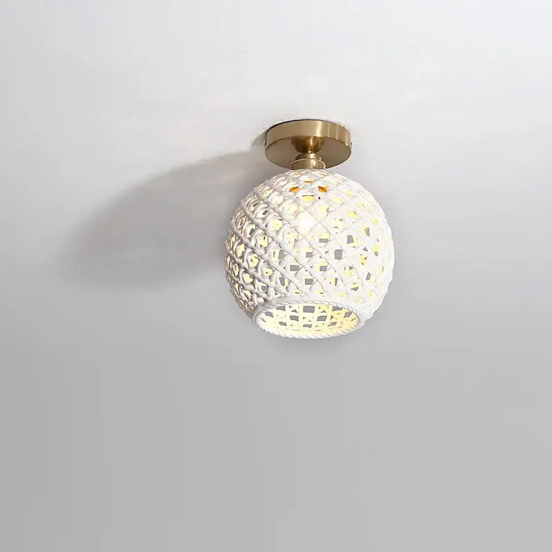 Modern hollow white and gold ceramic led ceiling light with intricate lattice design and brass mounting base for living room decorbites ceramic led ceiling