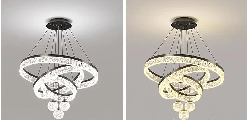 Modern black-finished chandelier with interlocking crystal rings and spherical glass orbs for indoor living and dining rooms