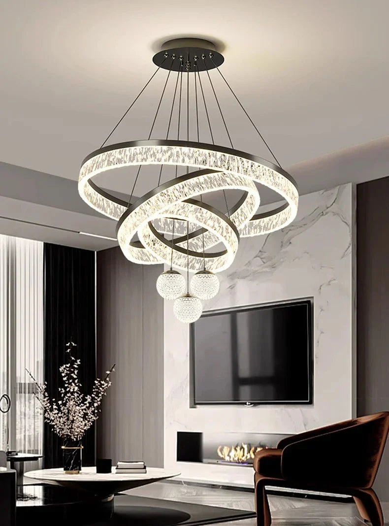 Modern home decor led pendant light with interlocking crystal-embedded rings hanging from black cords for indoor use
