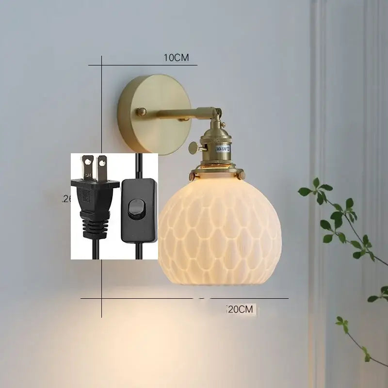 Vintage-style brass wall sconce with frosted honeycomb ceramic led wall shade by decorbites for bedroom light decor