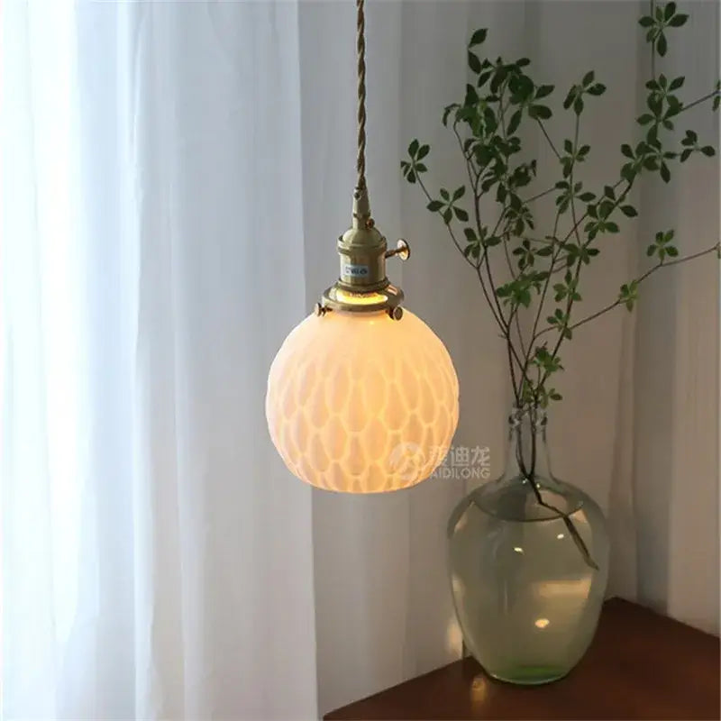 Modern honeycomb brass ceramic led wall sconce with warm-toned textured glass and twisted cord for decorbites ceramic led wall decor