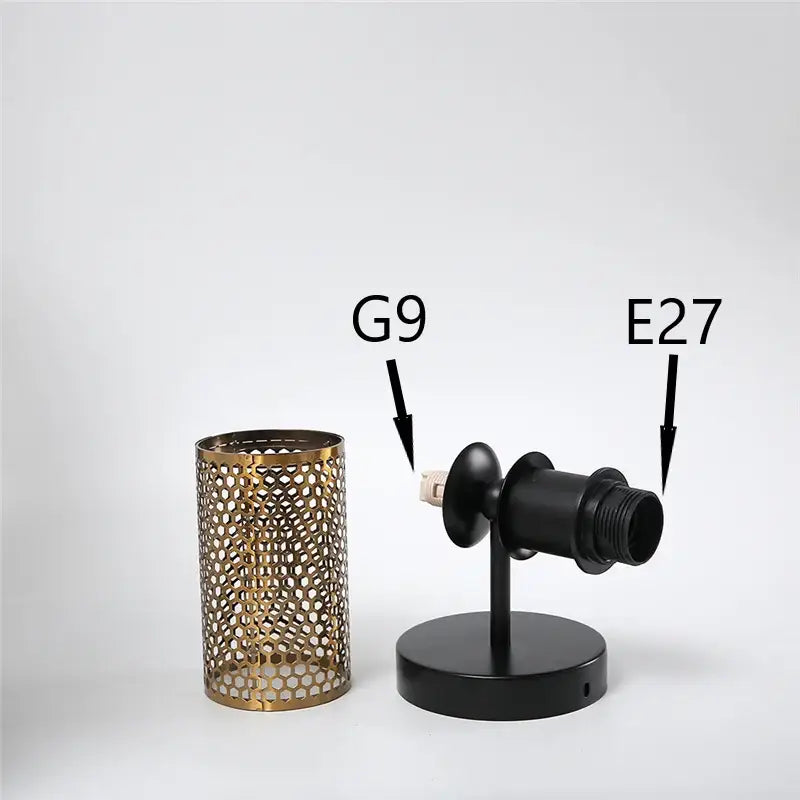 Modern honeycomb glass double headed led wall lamp with gold-toned cylindrical lampshade and intricate cutout decorbites double headed design