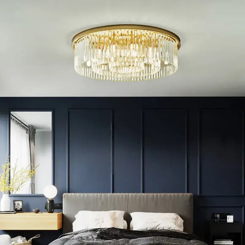Gold-toned decorbites crystal ceiling chandelier with cascading clear crystal prisms for modern industrial decor