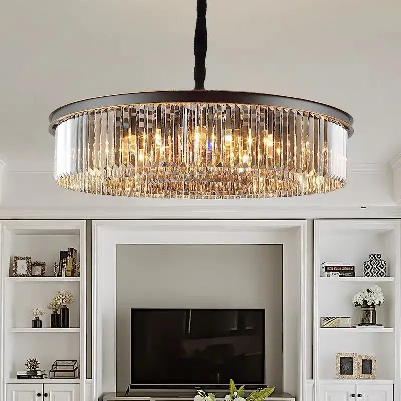 Modern industrial black decorbites crystal ceiling chandelier with dark metal frame and cascading clear crystal prisms emitting warm light