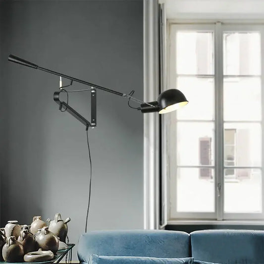 Black adjustable wall lamp with articulated arm and modern industrial design by decorbites dimmable led wall light