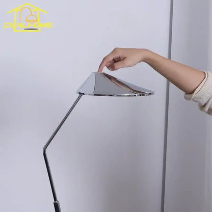 Modern industrial chrome floor lamp with adjustable slender articulated arm and conical shade for decorbites iron art decorative use