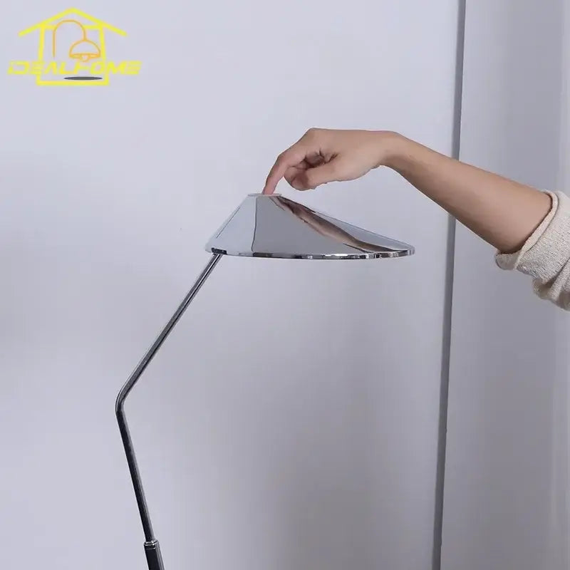 Modern industrial chrome floor lamp with adjustable slender articulated arm and conical shade for decorbites iron art decorative use