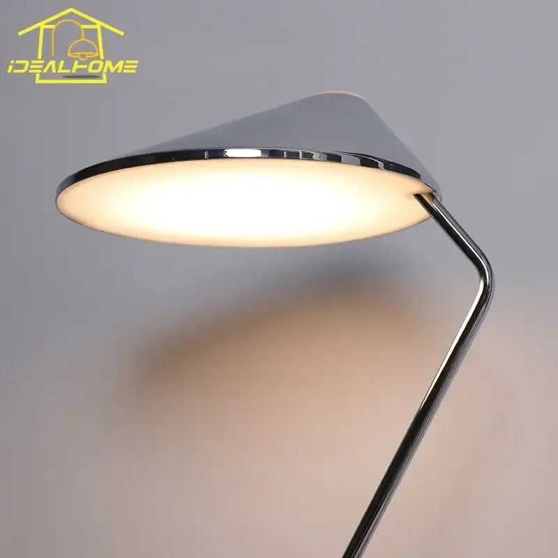Modern chrome floor lamp with sleek conical shade and warm light featuring decorbites iron art decorative design
