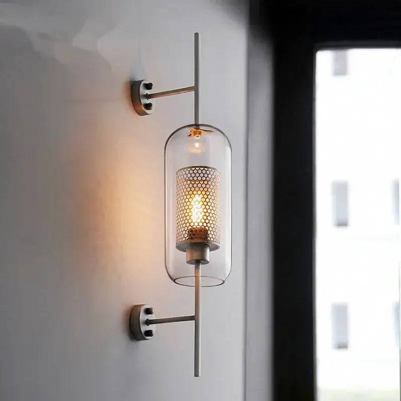 Modern industrial chrome glass wall light with perforated metal screen and exposed filament bulb for living room decorbites glass industrial
