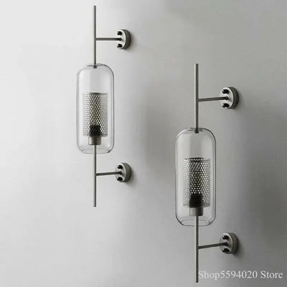 Modern industrial chrome glass wall lights with clear glass cylindrical shades and perforated metal inserts for living room decorbites glass industrial sconces