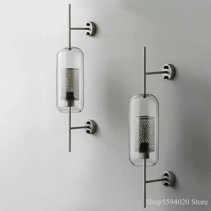 Modern industrial chrome glass wall lights with clear glass cylindrical shades and perforated metal inserts for living room decorbites glass industrial sconces