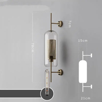 Modern industrial chrome glass wall sconce with brass finish clear glass cylinder and intricate mesh interior for wall lights decorbites glass industrial