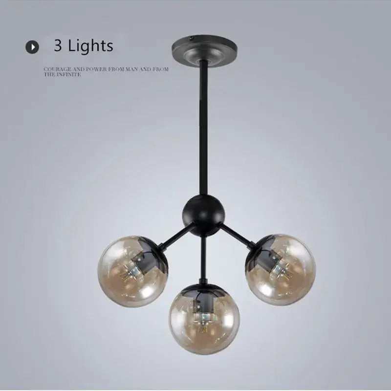 Black metal pendant light with three spherical amber glass bean globes for modern industrial decorbites glass bean chandelier