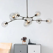 Modern black metal globe glass chandelier with clear bulbs for dining room decorbites industrial globe light