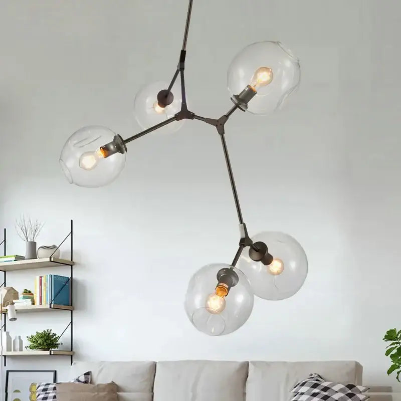 Modern industrial globe glass chandelier in black metal with five clear globes for dining room decorbites industrial globe lighting