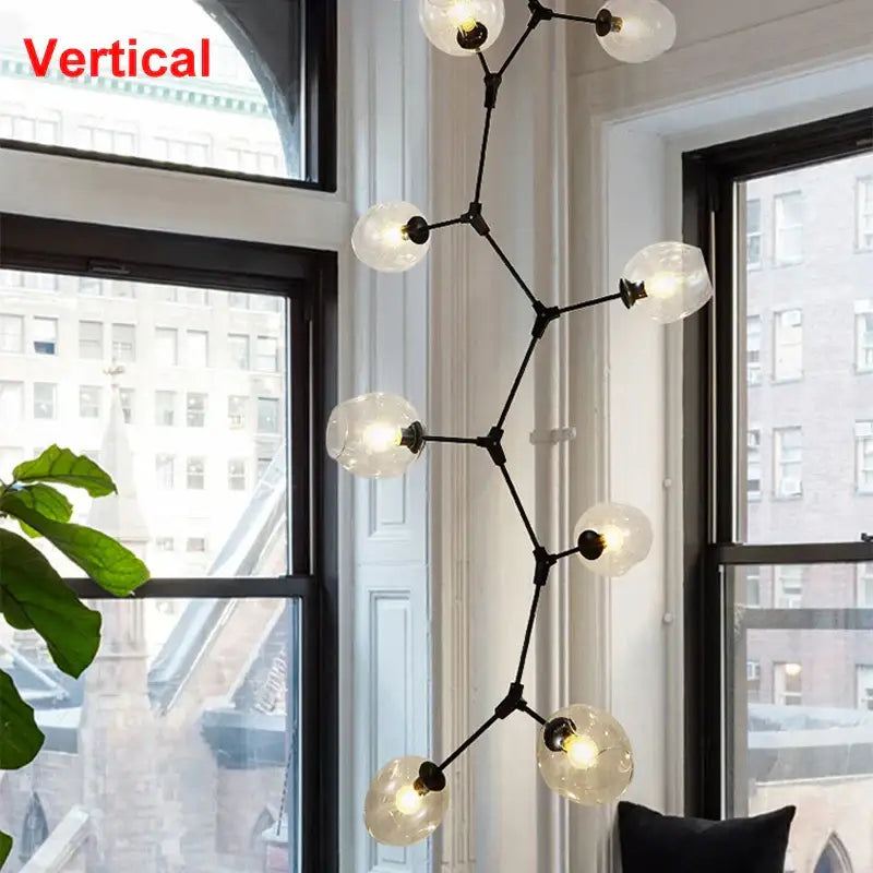 Black metal decorbites industrial globe glass chandelier with frosted globe lights for modern dining room decor
