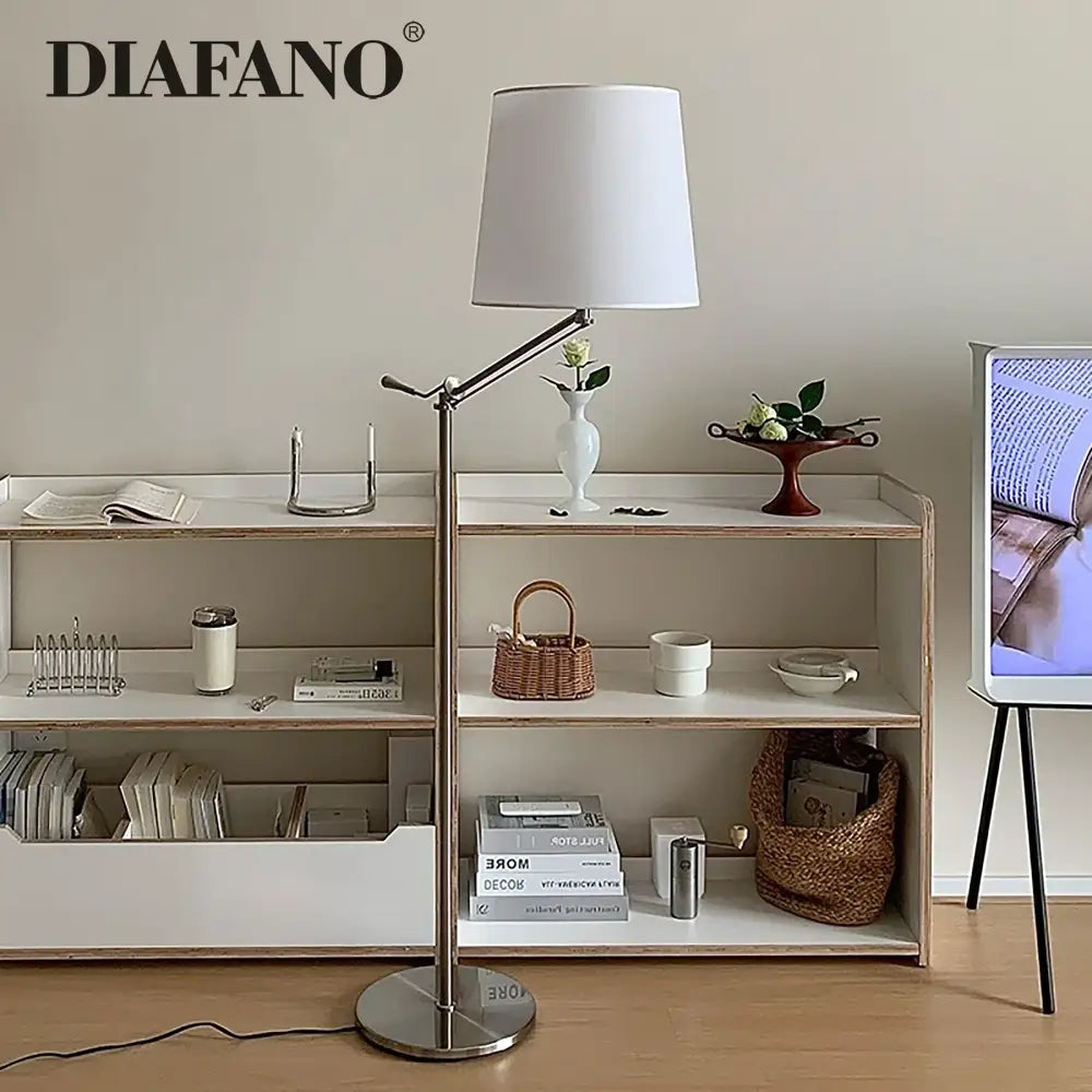 Silver-finished modern industrial metallic floor lamp with white cylindrical shade and decorbites adjustable led arm for living room