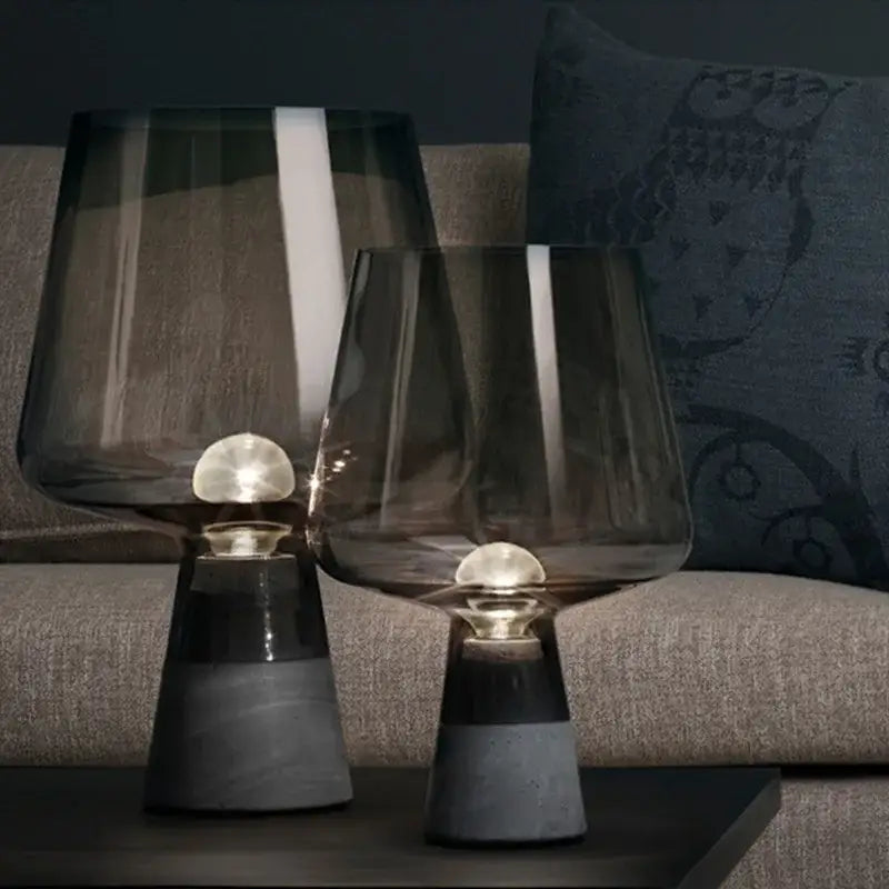 Modern industrial table lamp with dark smoked glass shades and leimu cement bases featuring glowing bulbs for bedroom decorbites leimu cement table