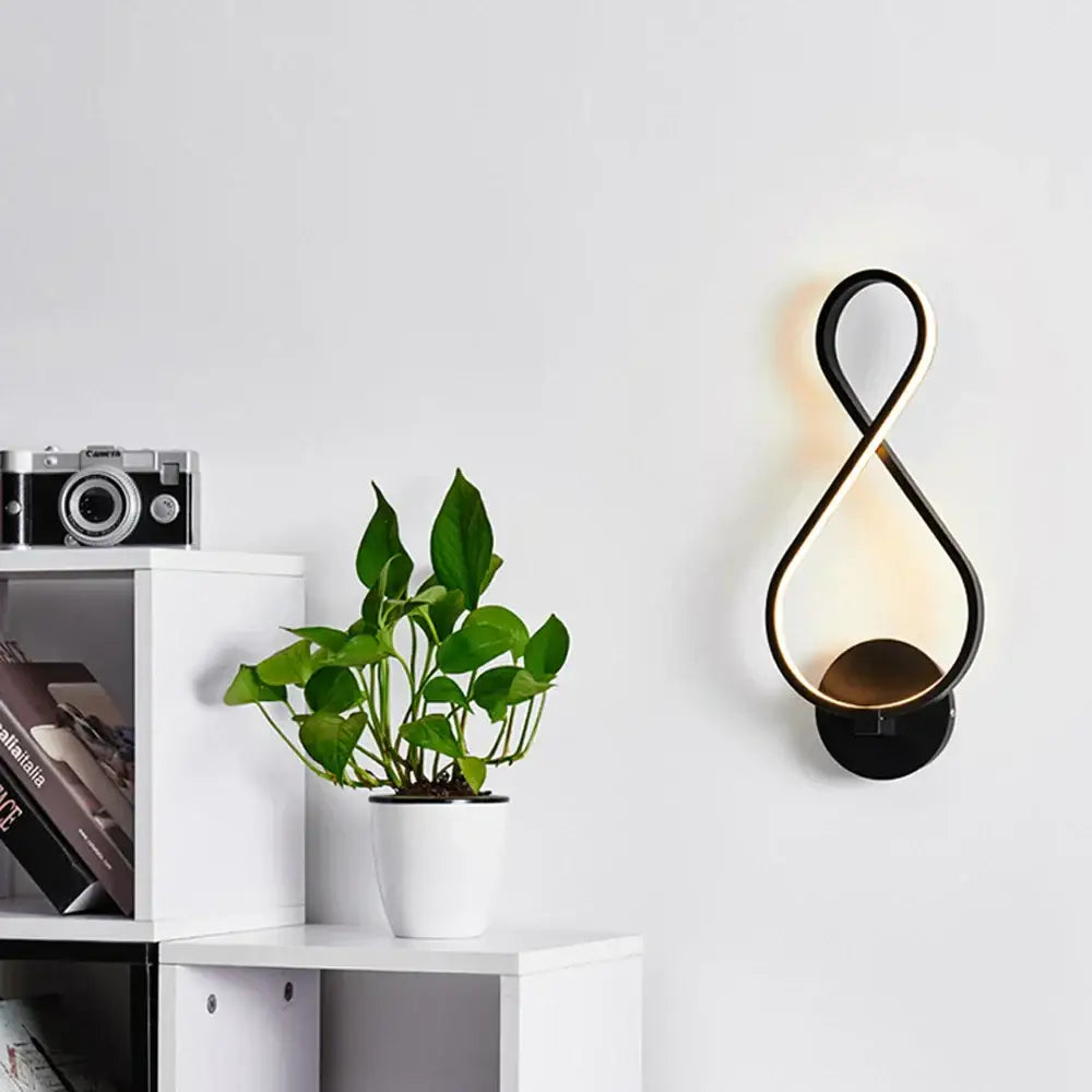Modern infinity black led wall light with sleek gold finish emitting warm light for living room decorbites led wall light