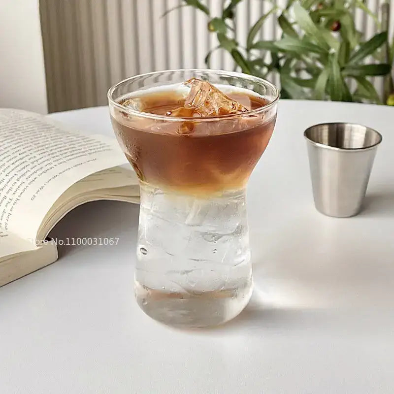 Modern insulated decorbites glass drink cup filled with iced coffee showcasing a clear textured glass drink cup set