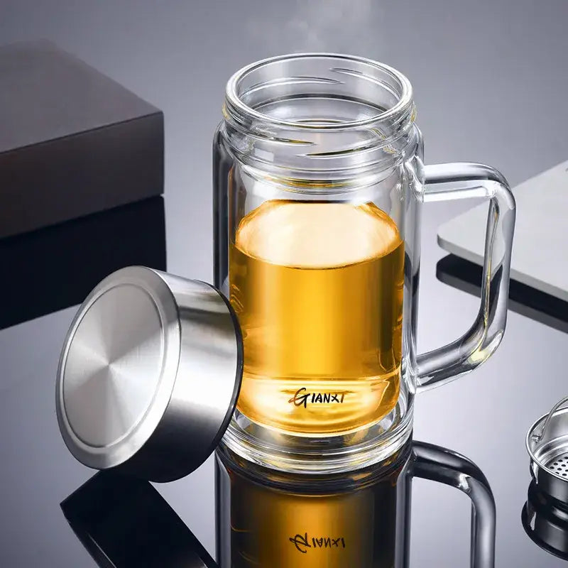Modern insulated glass tea cup with double-walled design stainless steel lid and handle filled with golden glass tea