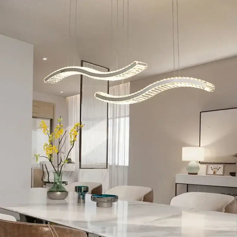 Modern silver-toned decorbites crystal led ceiling chandelier with wave design and embedded crystal accents for dining room decor