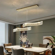 Modern interlocking crystal led ceiling chandelier with two curved glass rings emitting warm glow for dining room decorbites crystal led