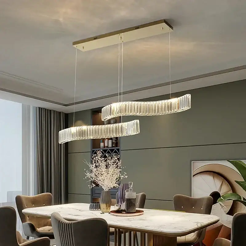 Modern interlocking crystal led ceiling chandelier with two curved glass rings emitting warm glow for dining room decorbites crystal led