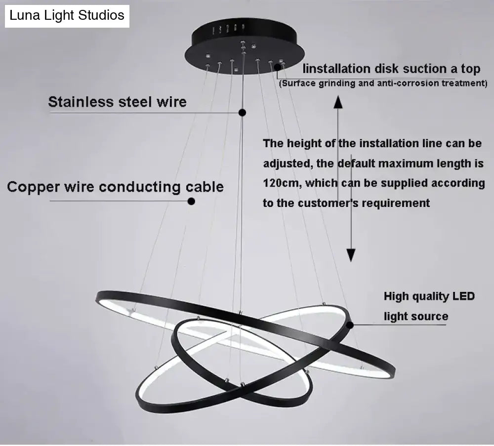 Modern black circular led pendant lights with sleek interlocking rings and stainless steel wire for dining room