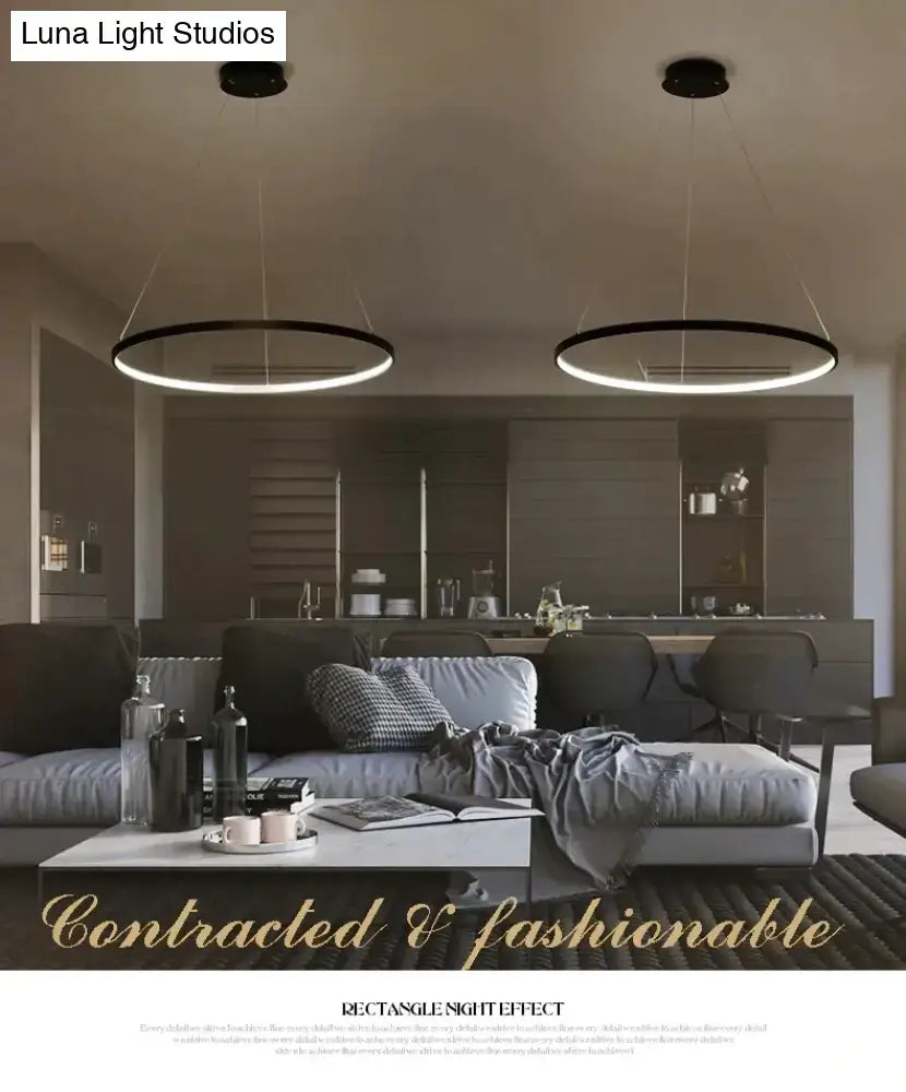 Black circular modern pendant lights with sleek interlocking ring design for dining room lighting