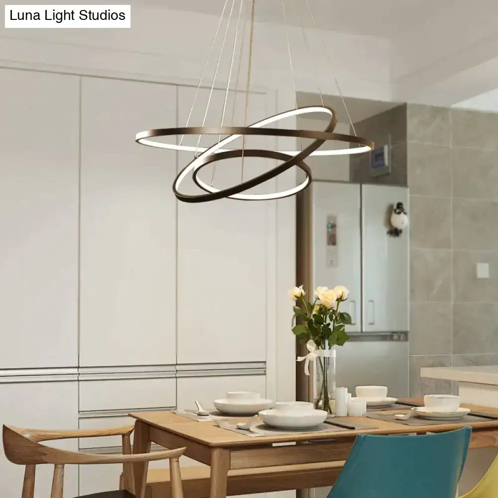 Modern black interlocking ring pendant lights with illuminated led strips designed for dining room use