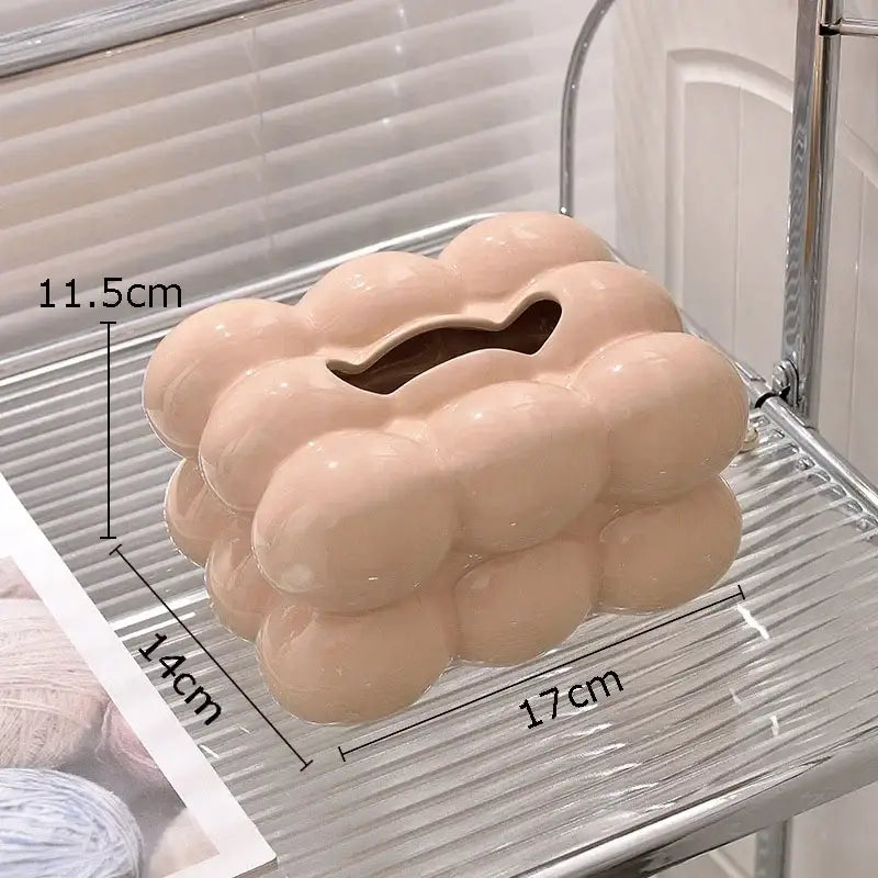 Pastel pink ceramic tissue box with cloud-like bubbly design and cut-out slot for decorbites cotton candy use
