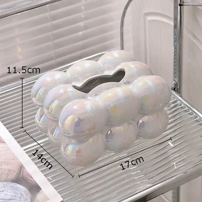 Modern iridescent blue and cream ceramic tissue box with a heart-shaped opening inspired by cotton candy ceramic decorbites design