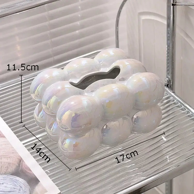 Modern iridescent blue and cream ceramic tissue box with a heart-shaped opening inspired by cotton candy ceramic decorbites design