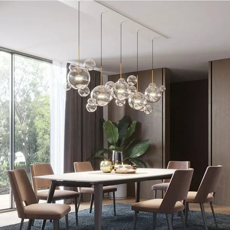 Modern iridescent colorful glass ball pendant light with gold-toned metal accents for dining room decorbites colorful glass