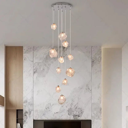 Modern iron and glass 6 light pendant light with crystal faceted globes as a dining room statement piece focal point