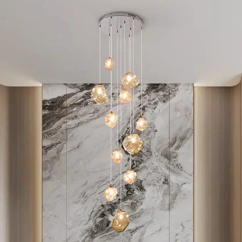Modern iron and glass 6 light pendant light with golden faceted glass shades and silver mount as dining room statement piece
