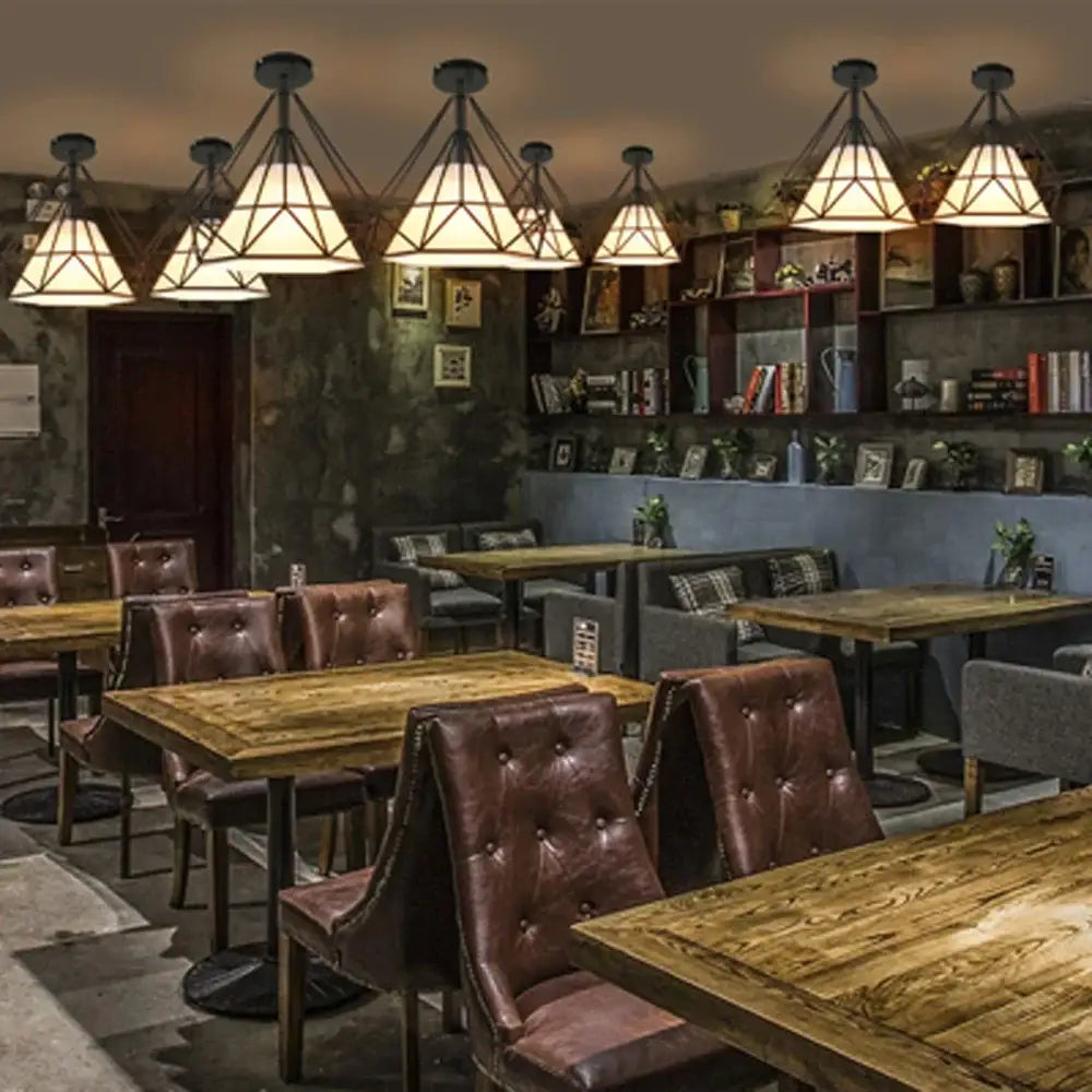 Modern iron cage ceiling lamp with geometric triangular warm lights and dark metal decorbites iron cage frame