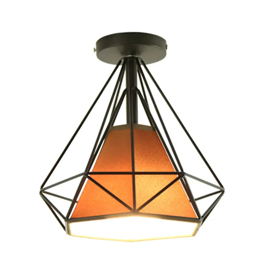 Modern iron cage ceiling lamp with a black metal geometric frame and amber textured glass shade by decorbites iron cage
